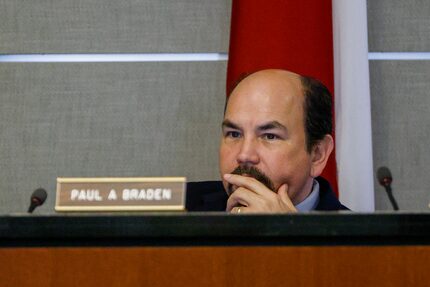 Former board member Paul Braden listens while a report is given during a Texas Department of...