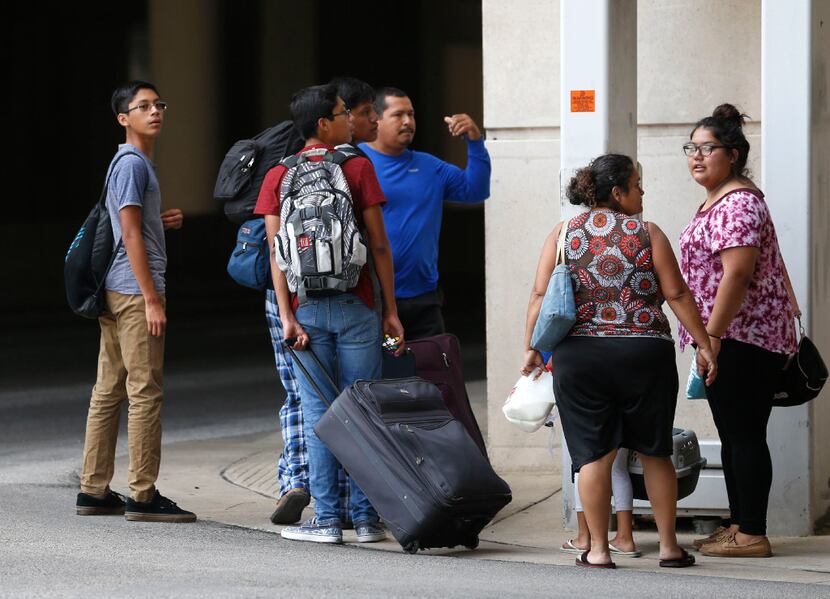Evacuees from South Texas arrive at the mega-shelter outside the Kay Bailey Hutchison...