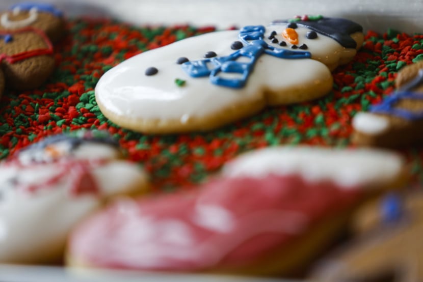 Gingerbread and sugar cookies are decorated with classic and local Dallas themes at Society...