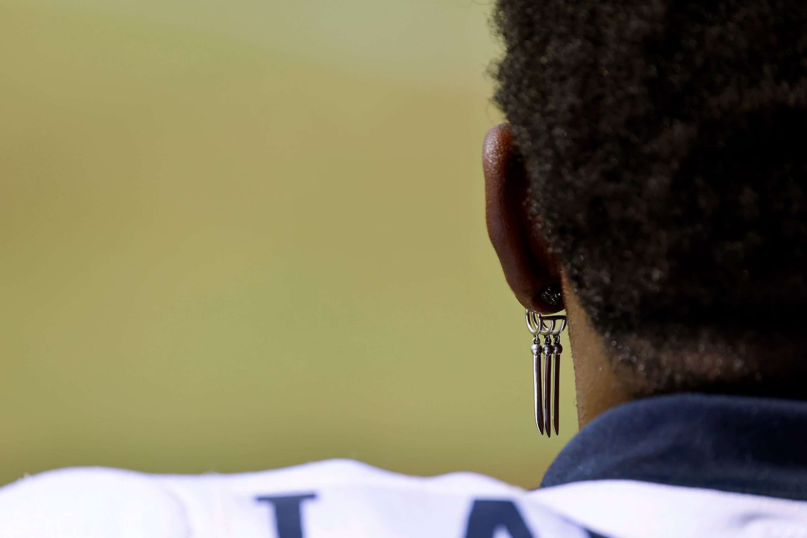 Dallas Cowboys defensive end DeMarcus Lawrence (90) wore his earrings to a scrimmage with...