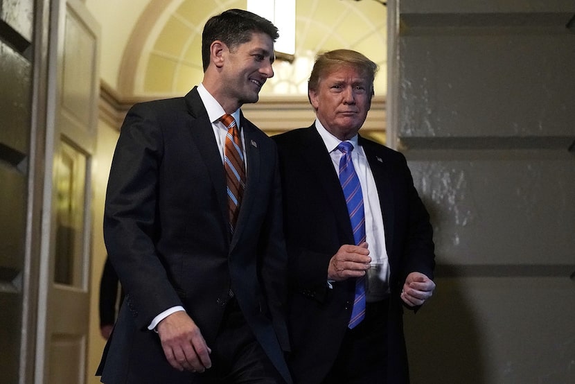 Accompanied by Speaker of the House Rep. Paul Ryan, R-Wis., (left), U.S. President Donald...