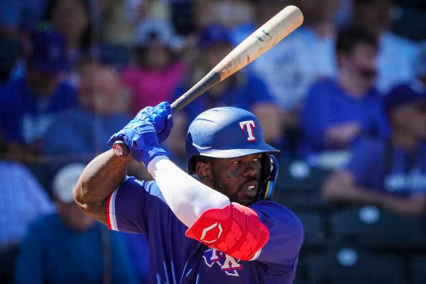Texas Rangers outfielder Adolis García prepares to bat during the fifth inning of a spring...