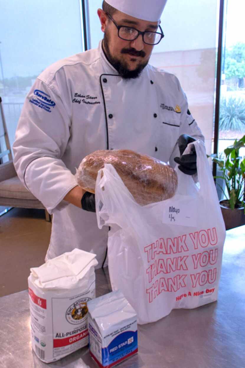 Chef Ethan Starr bags some of the Culinary School of Fort Worth's freshly baked bread for a...