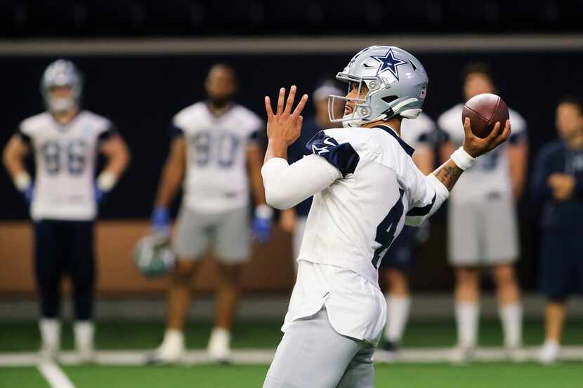 Dallas Cowboys quarterback Dak Prescott (4) throws a pass during a team OTA practice at The...