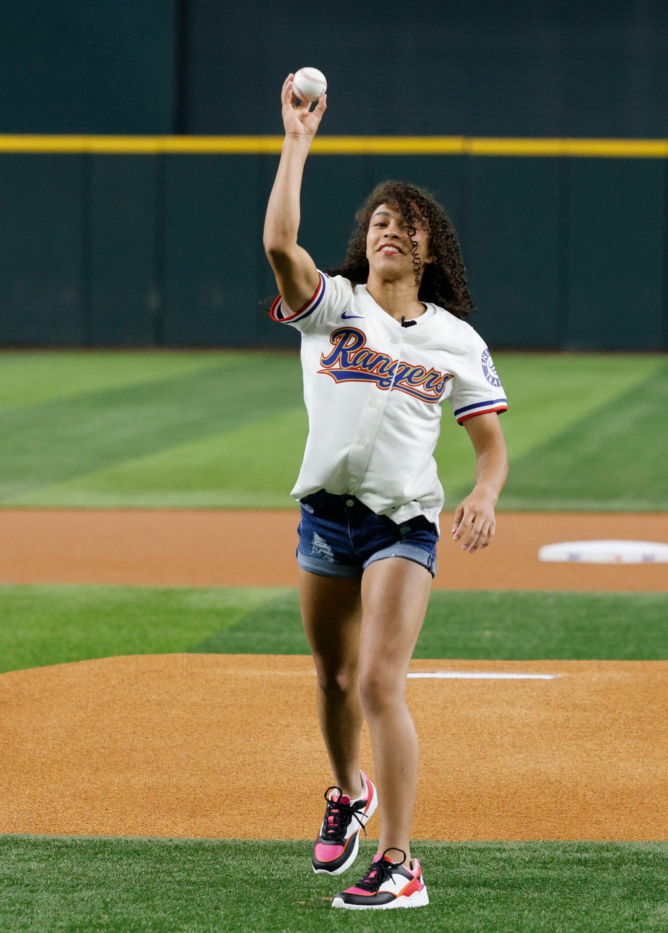 Olympic Gold medalist Hezly Rivera from Plano throws out a ceremonial first pitch before a...