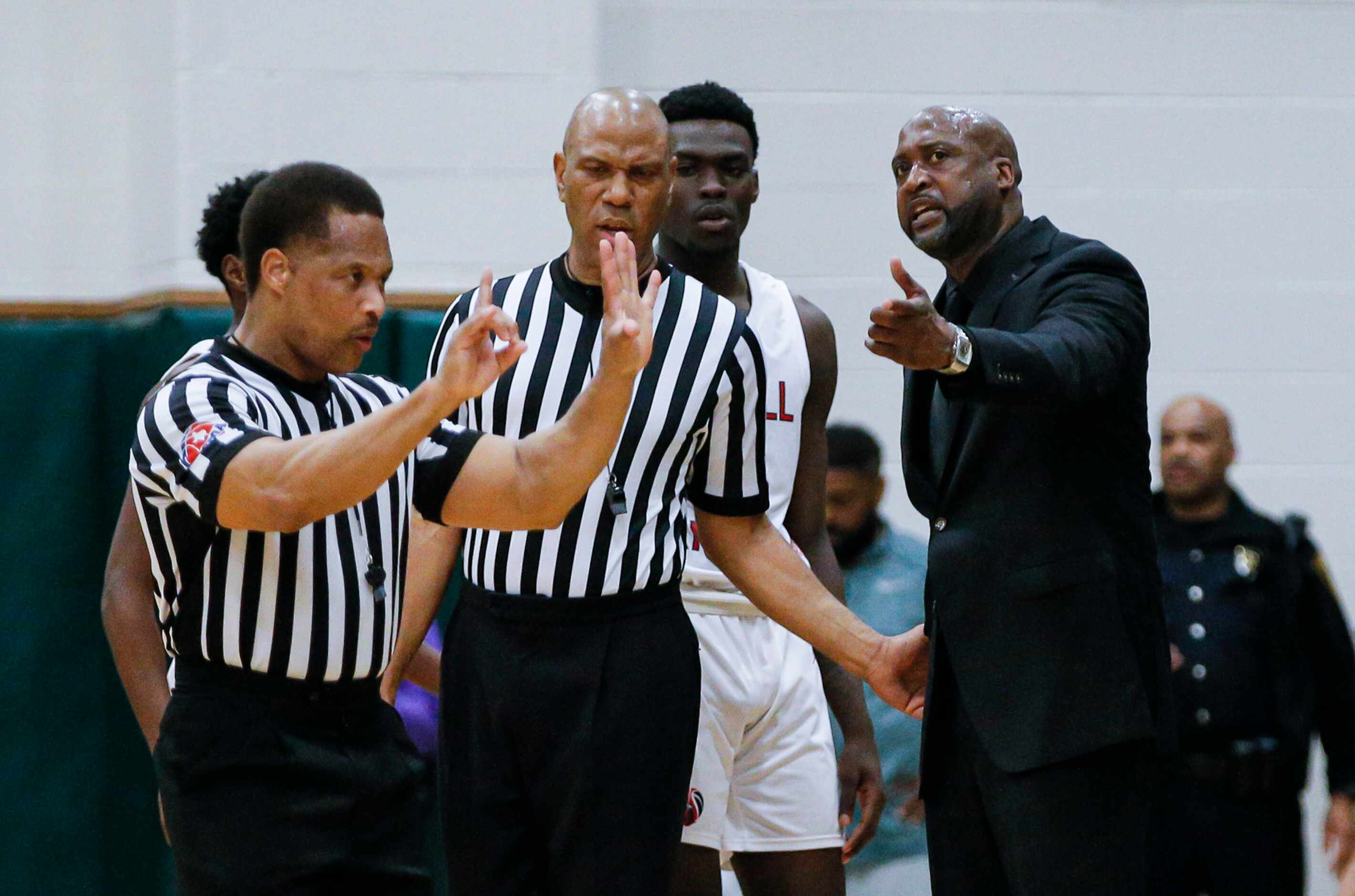 Kimball head coach Nick Smith argues a call during the second half of a Class 5A Region II...