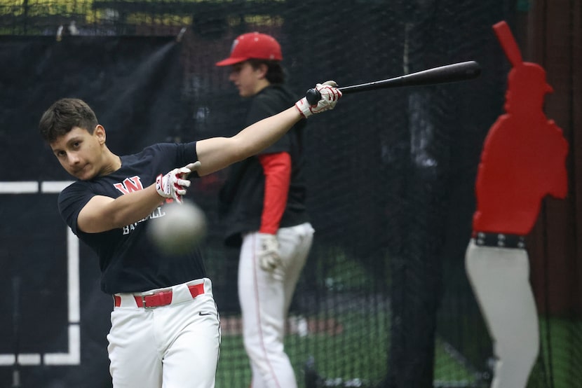 Woodrow Wilson High’s Caleb Rodriguez hits during a team practice on Wednesday, May 15,...