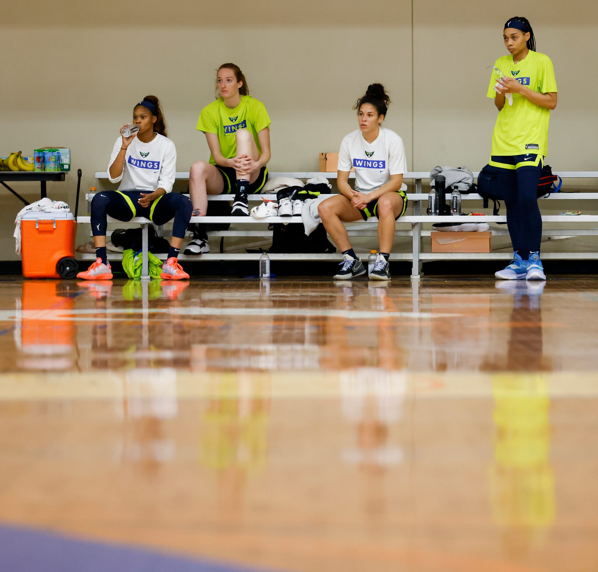 From left, Dallas Wings players Moriah Jefferson, Morgan Bertsch, top draft pick Veronica...