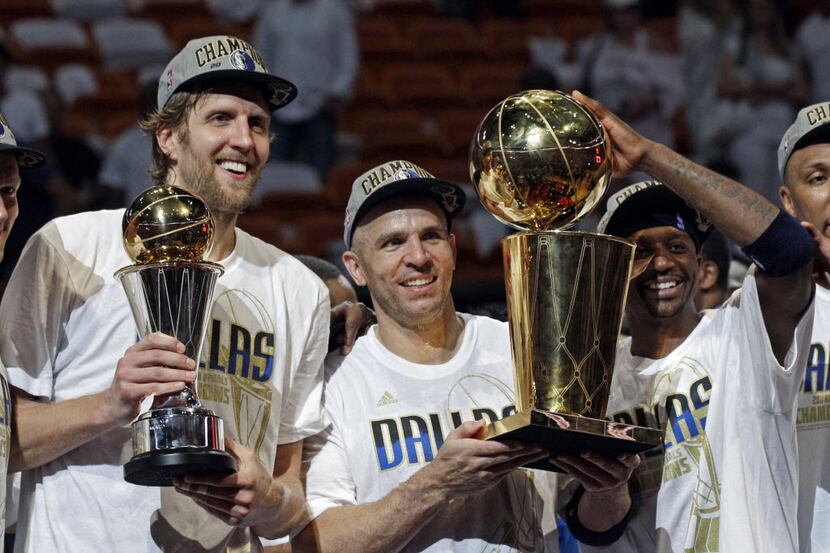 On June 12, 2011, Dallas Mavericks' Dirk Nowitzki, Jason Kidd and Jason Terry hold, from...