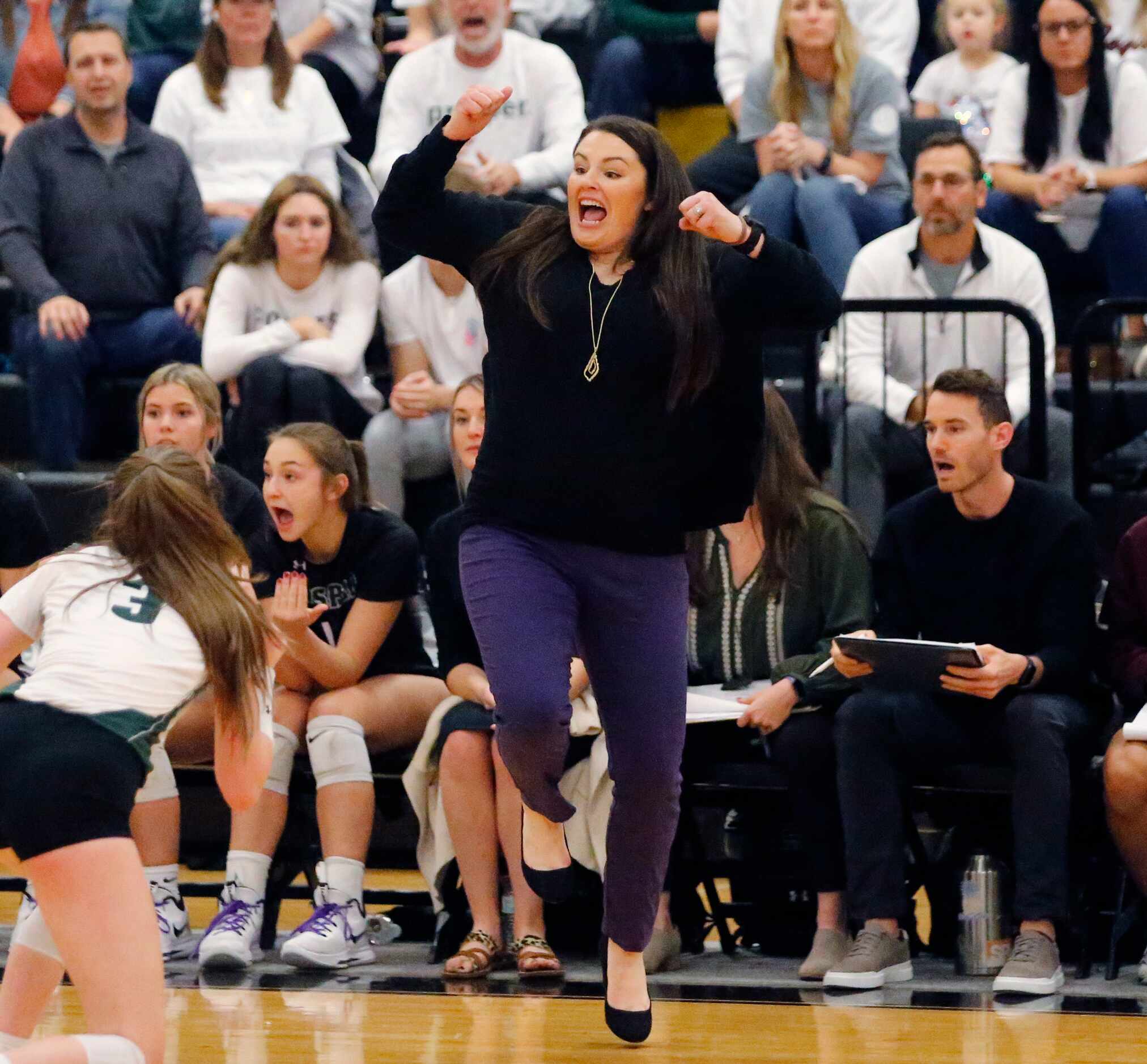 Prosper High School head coach Erin Kauffman reacts to winning game three of the first round...