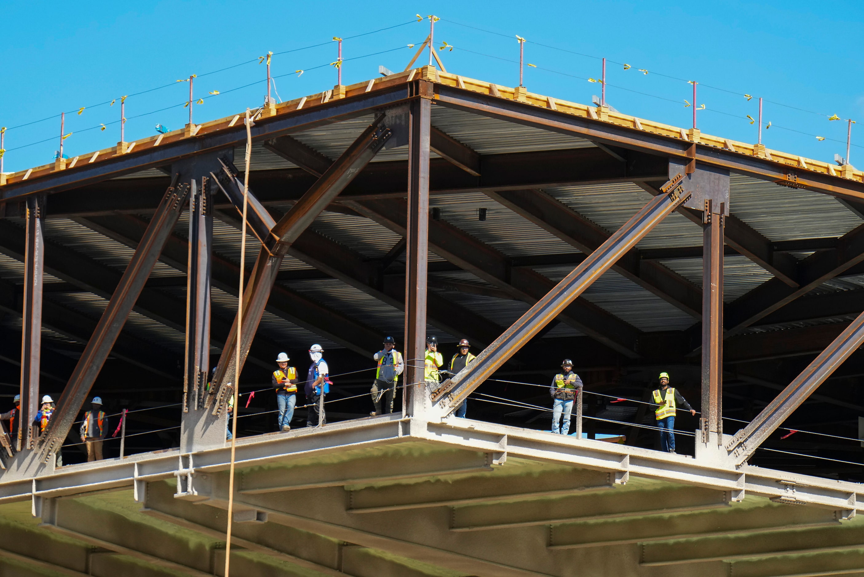 Workers at the site of the under construction National Medal of Honor Museum pause to watch...