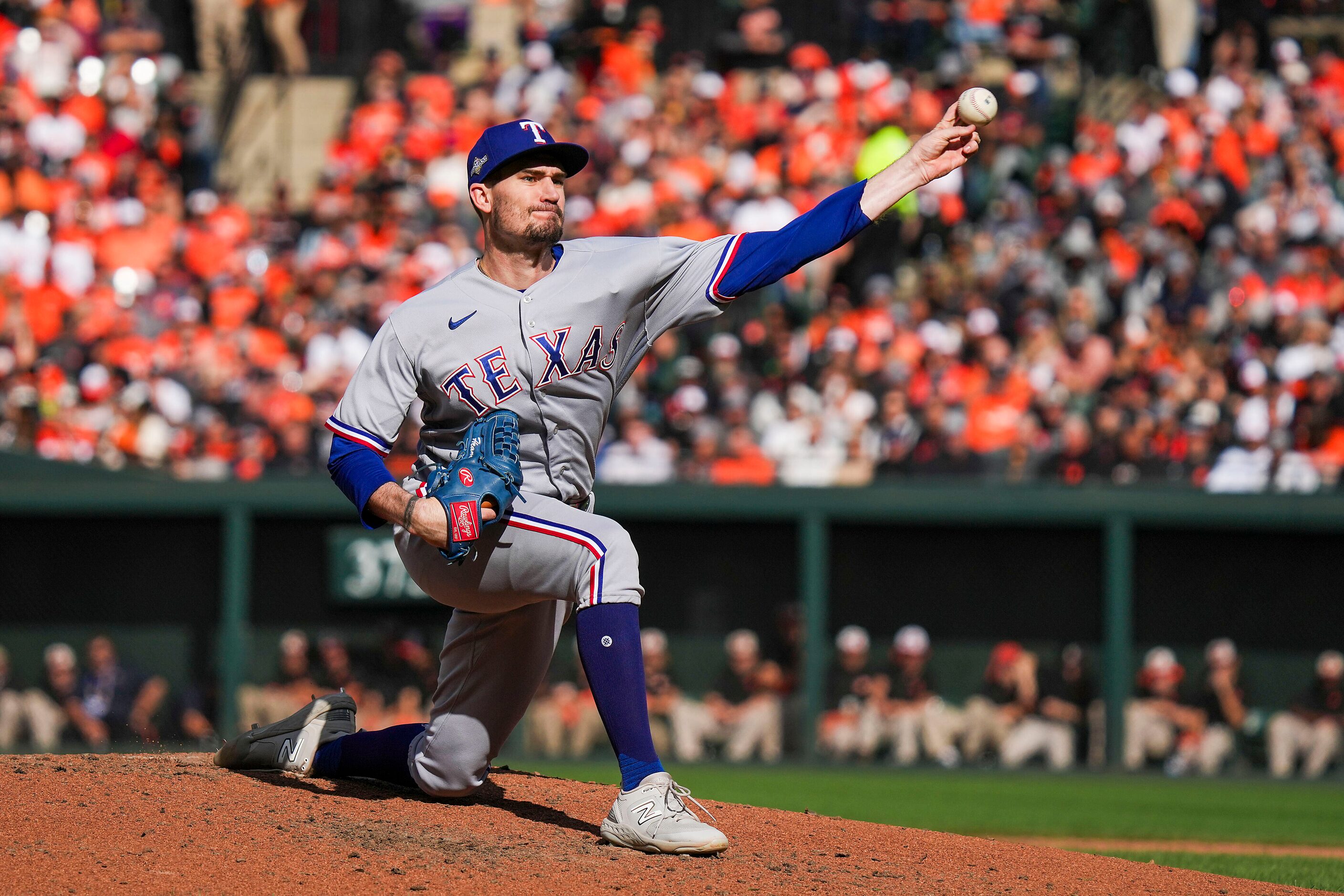 Texas Rangers starting pitcher Andrew Heaney delivers during the third inning in Game 1 of...