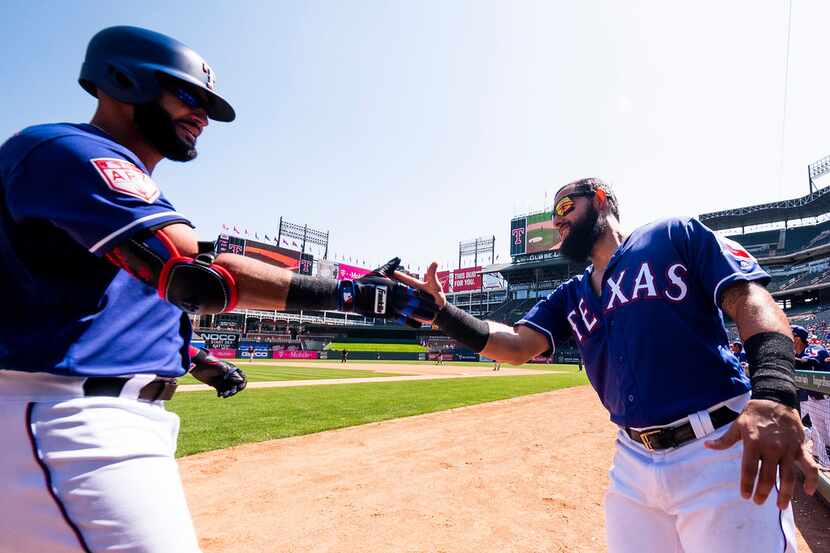 Texas Rangers outfielder Nomar Mazara (left) celebrates with second baseman Rougned Odor...