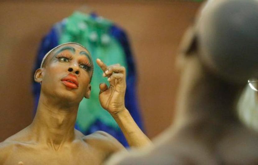 
Ivan Jones of Dallas applies false eyelashes as he transforms himself into Mrs. T Time as...