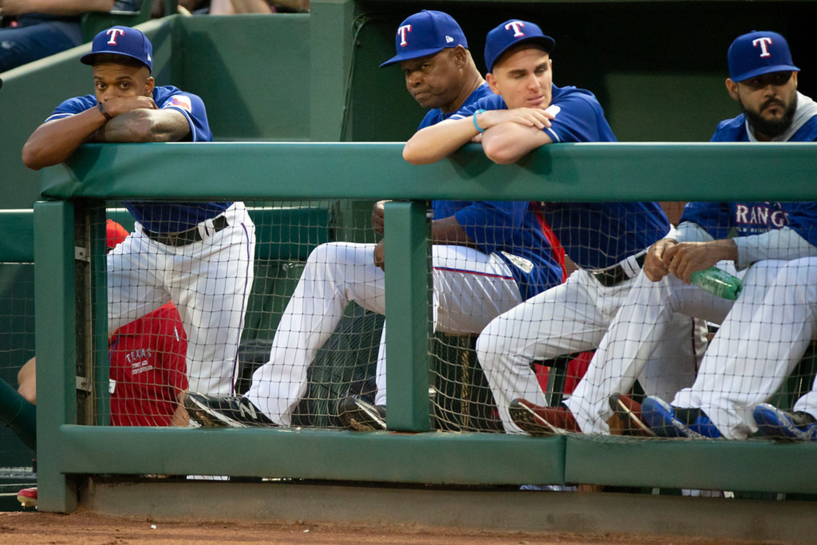 Texas Rangers outfielder Delino DeSheilds watches the game from the end of the dugout during...