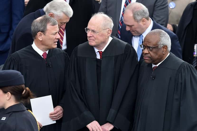 From left: U.S. Chief Justice John Roberts, Justice Anthony Kennedy and Justice Clarence...