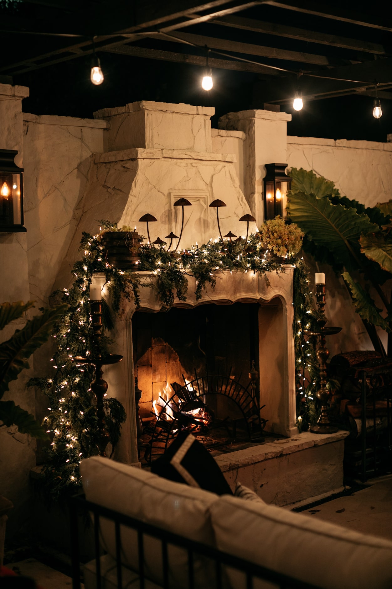 Inside, Burkle decorates with faux trees and garland. Outside, however, Burkle utilizes real...