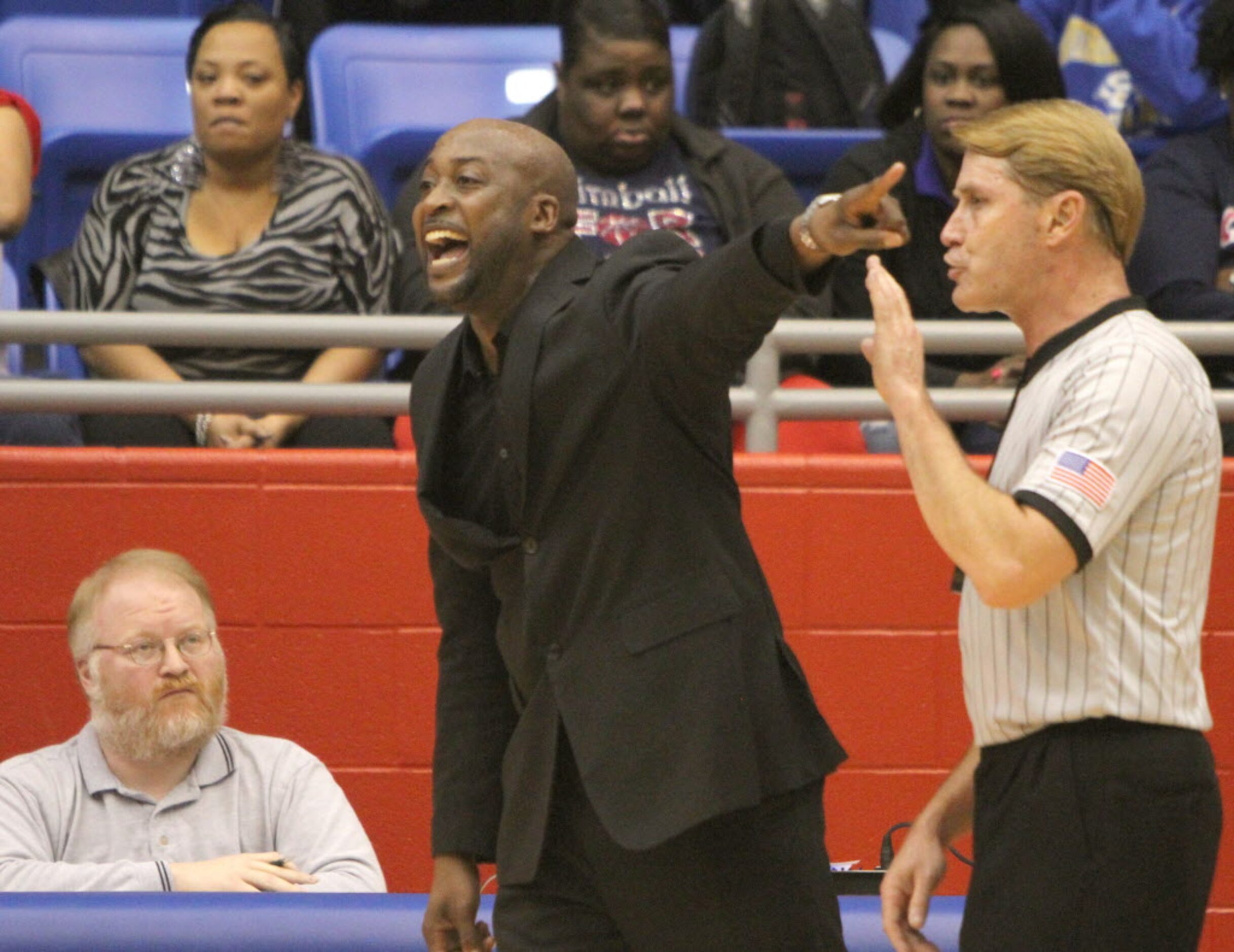 Dallas Kimball head coach Nick Smith makes a point during second half action of their game...