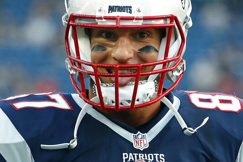 New England Patriots tight end Rob Gronkowski strikes a pose before a preseason NFL football...