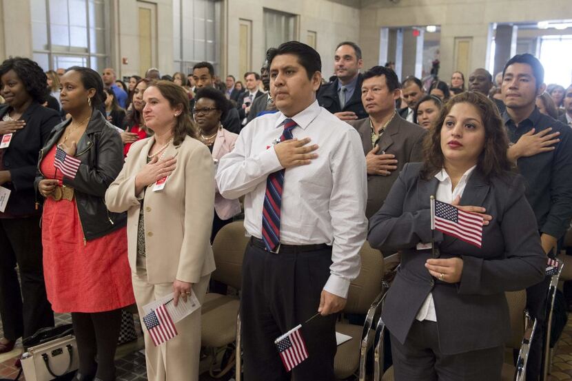 Candidates for U.S. citizenship take the oath of allegiance this week in a ceremony in...