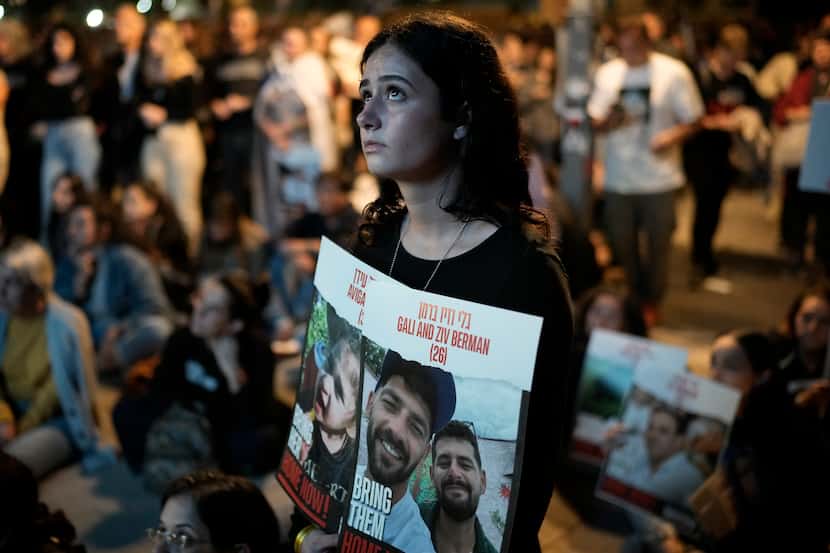 People participate in a show of solidarity with hostages being held in the Gaza Strip, near...