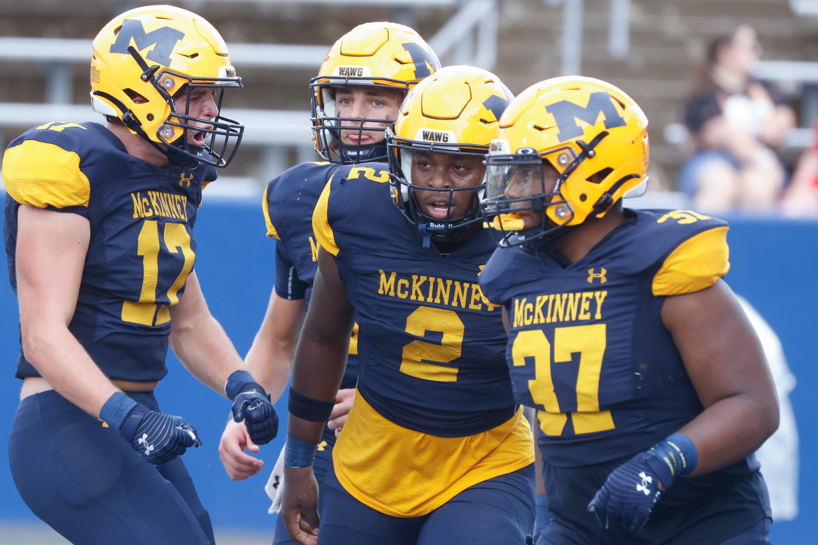 McKinney High players including Tyler Stanley (17), left, and Bryan Jackson (2) celebrate a...