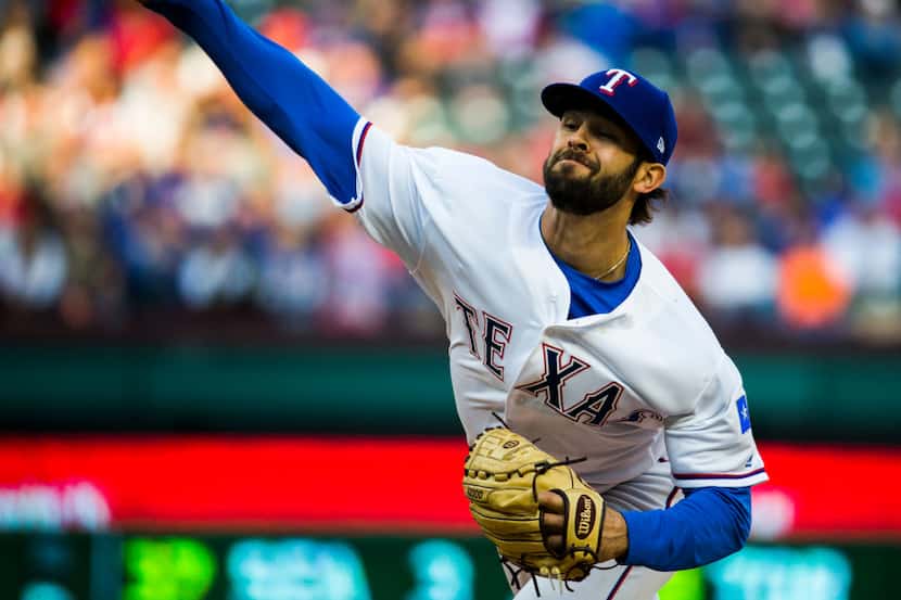 Texas Rangers pitcher Nick Martinez pitches during the first inning of an MLB game between...