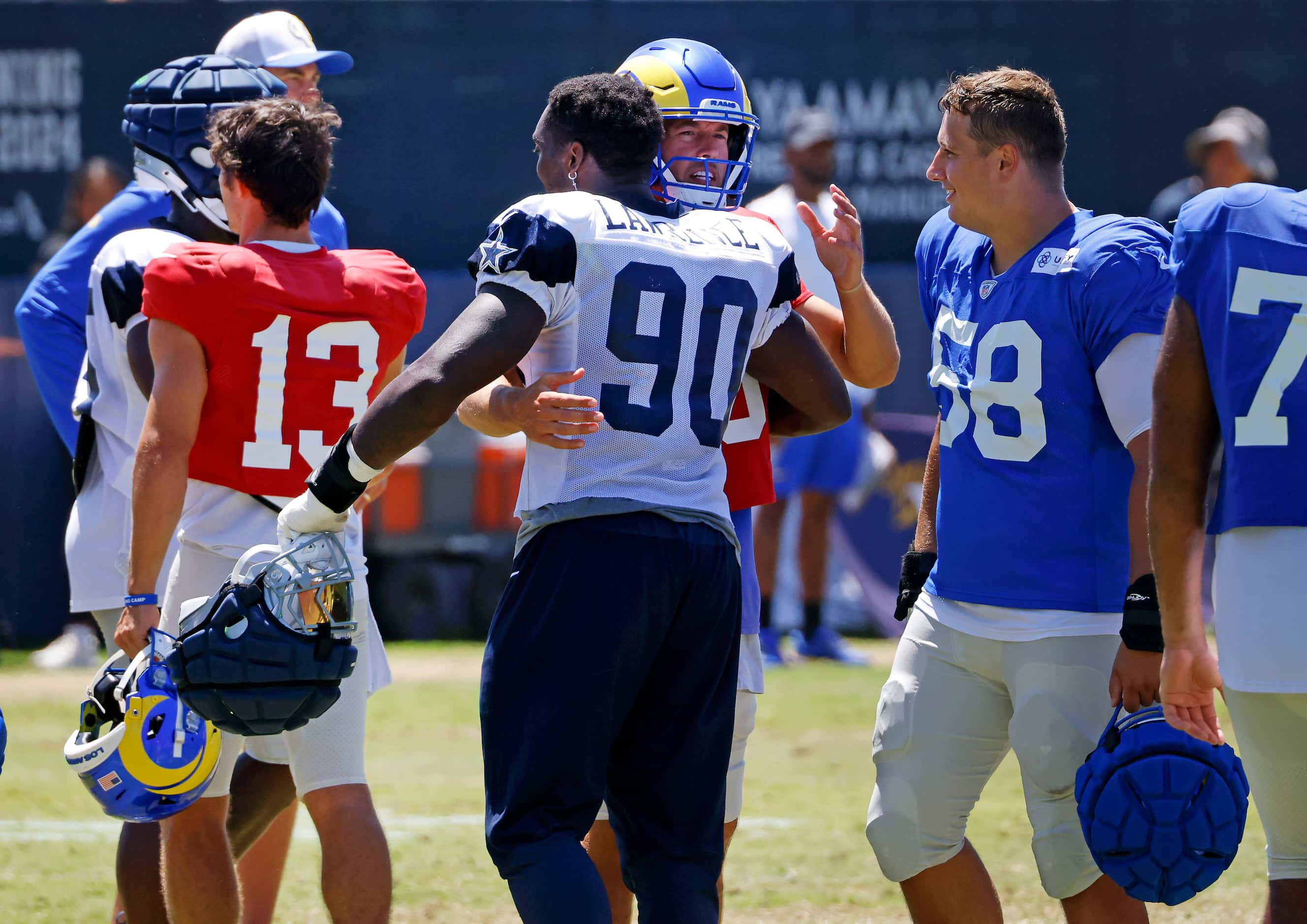 Dallas Cowboys defensive end DeMarcus Lawrence (90) and Los Angeles Rams quarterback Matthew...