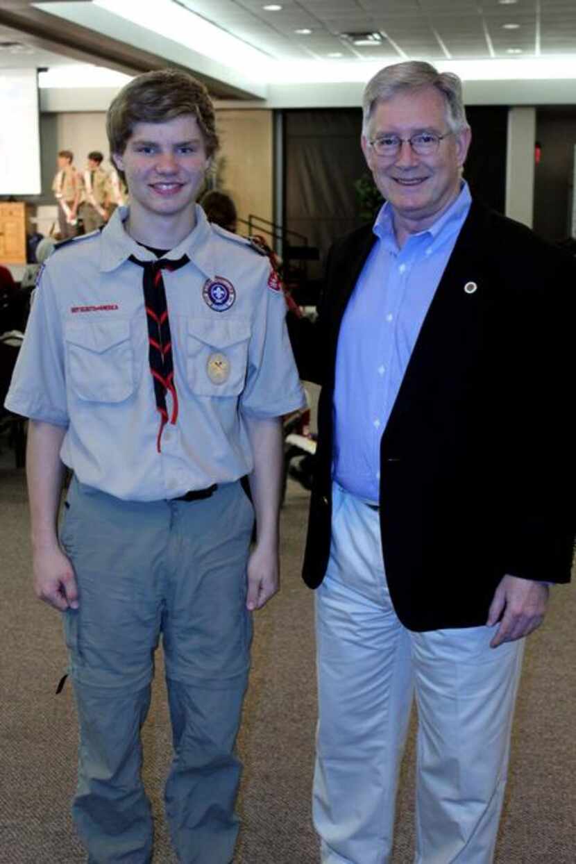 
Brandon Walters of Boy Scout Troop 100 stands with Garland Mayor Douglas Athas at the Court...