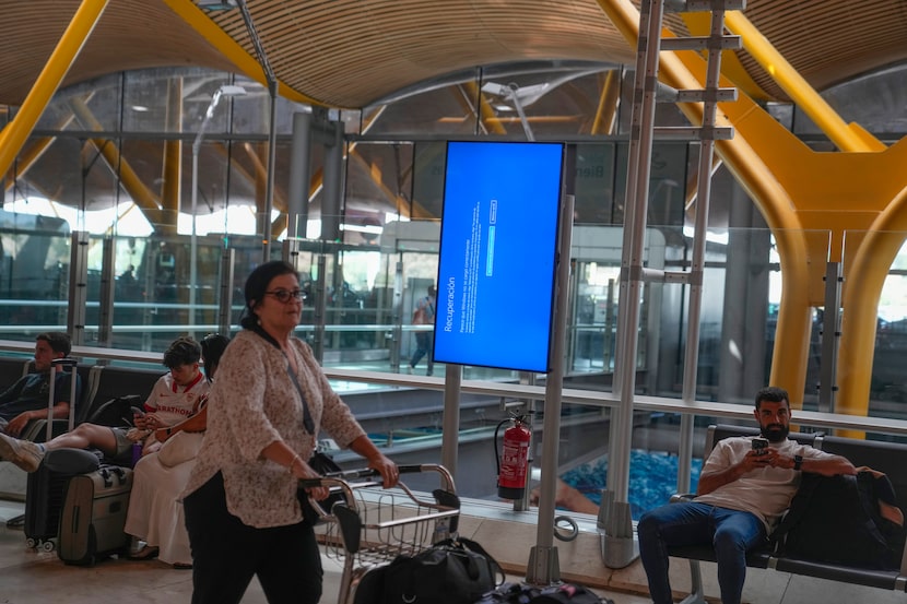 A screen shows a Microsoft Windows recuperation message at Barajas international airport in...