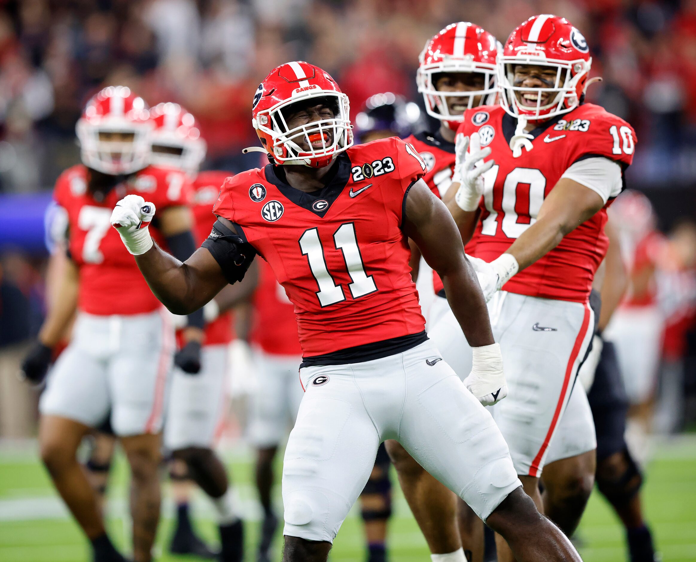 Georgia Bulldogs linebacker Jalon Walker (11) celebrates his fourth quarter sack of TCU...