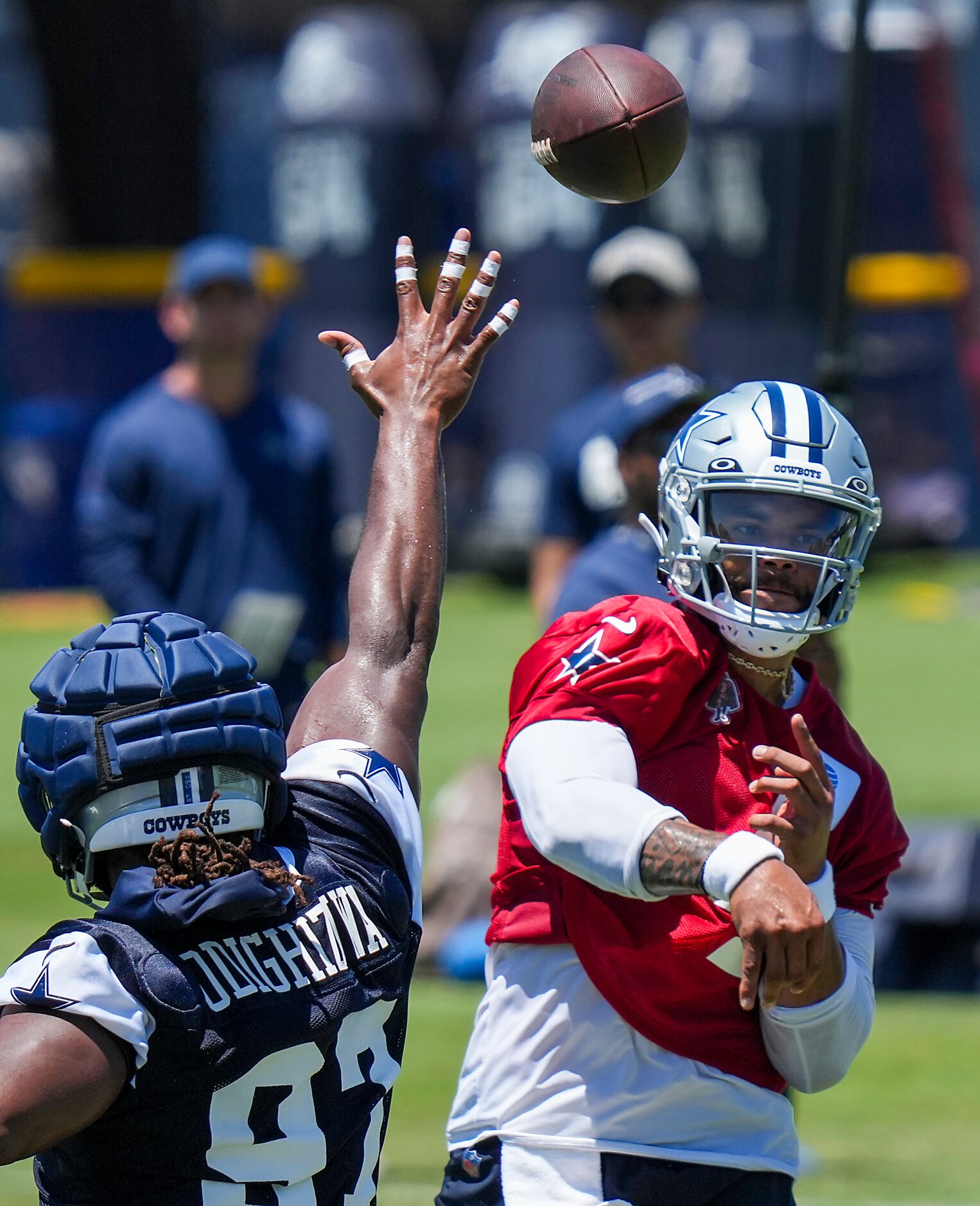 Dallas Cowboys quarterback Dak Prescott (4) throws a pass over defensive tackle Osa...