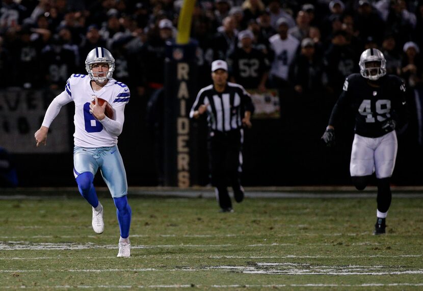 Dallas Cowboys punter Chris Jones (6) runs the ball against the Oakland Raiders after a fake...