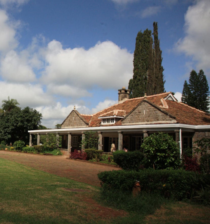 Lush landscaped grounds surround the Karen Blixen Museum near Nairobi, Kenya. The bungalow...