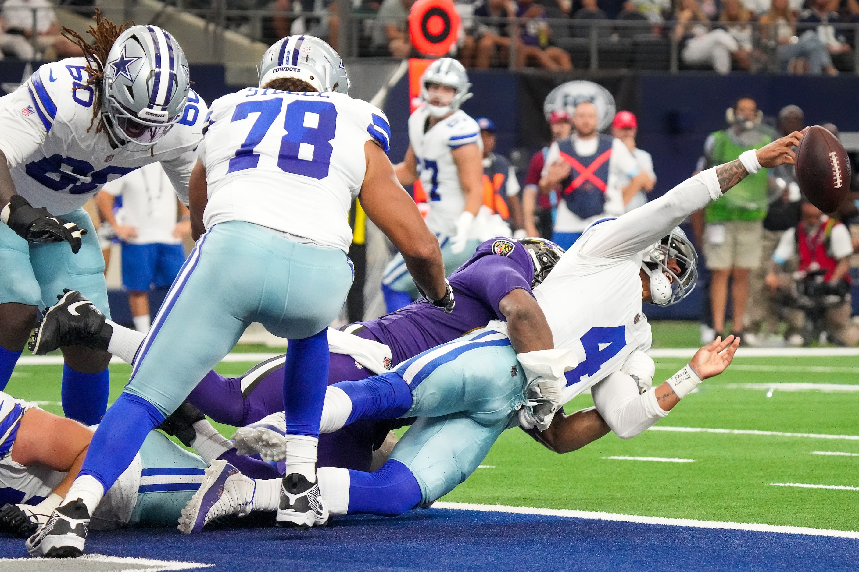 Dallas Cowboys quarterback Dak Prescott (4) barely gets off a pass before being sacked for...