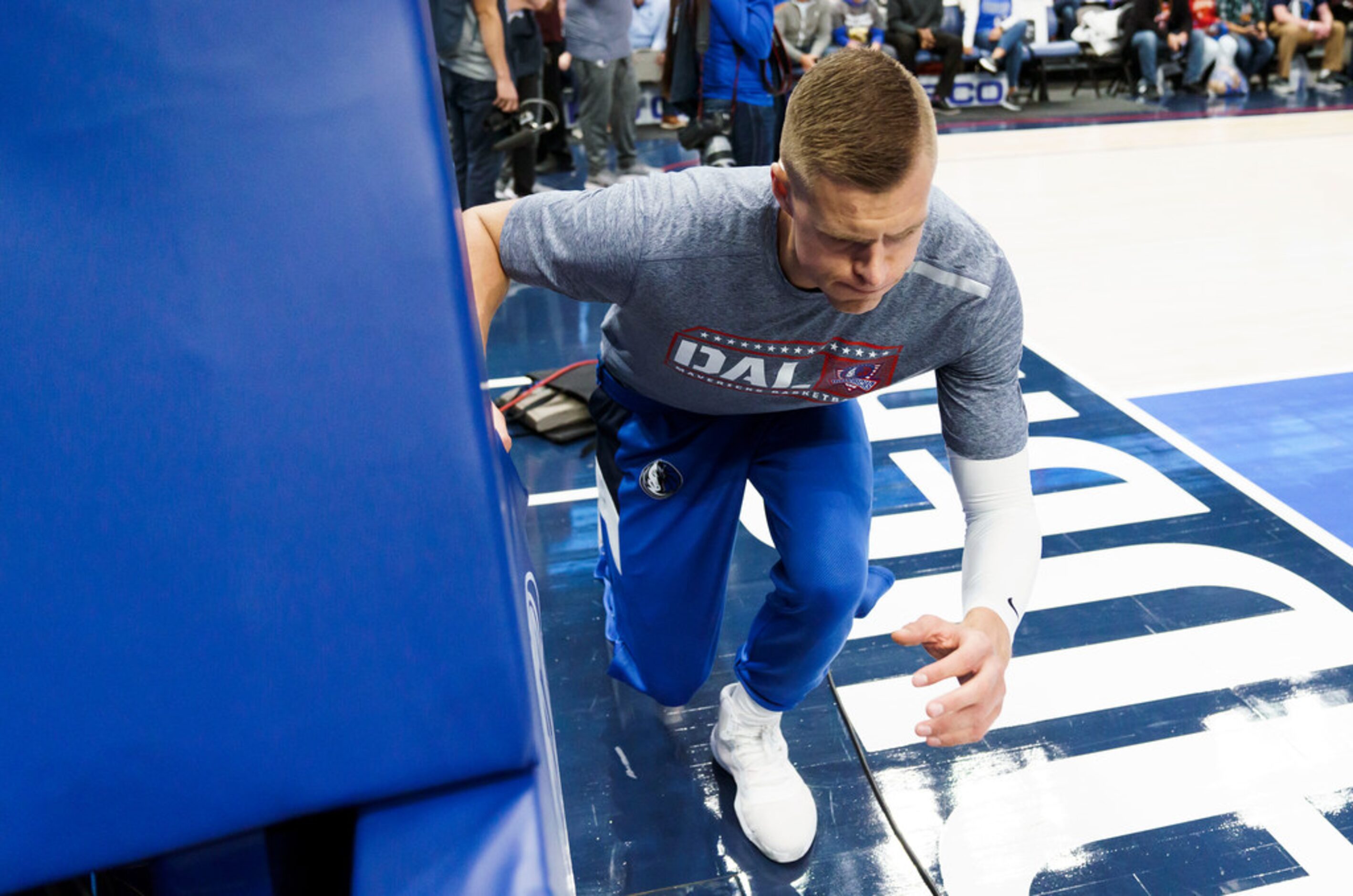 Dallas Mavericks forward Kristaps Porzingis warms up before an NBA basketball game against...