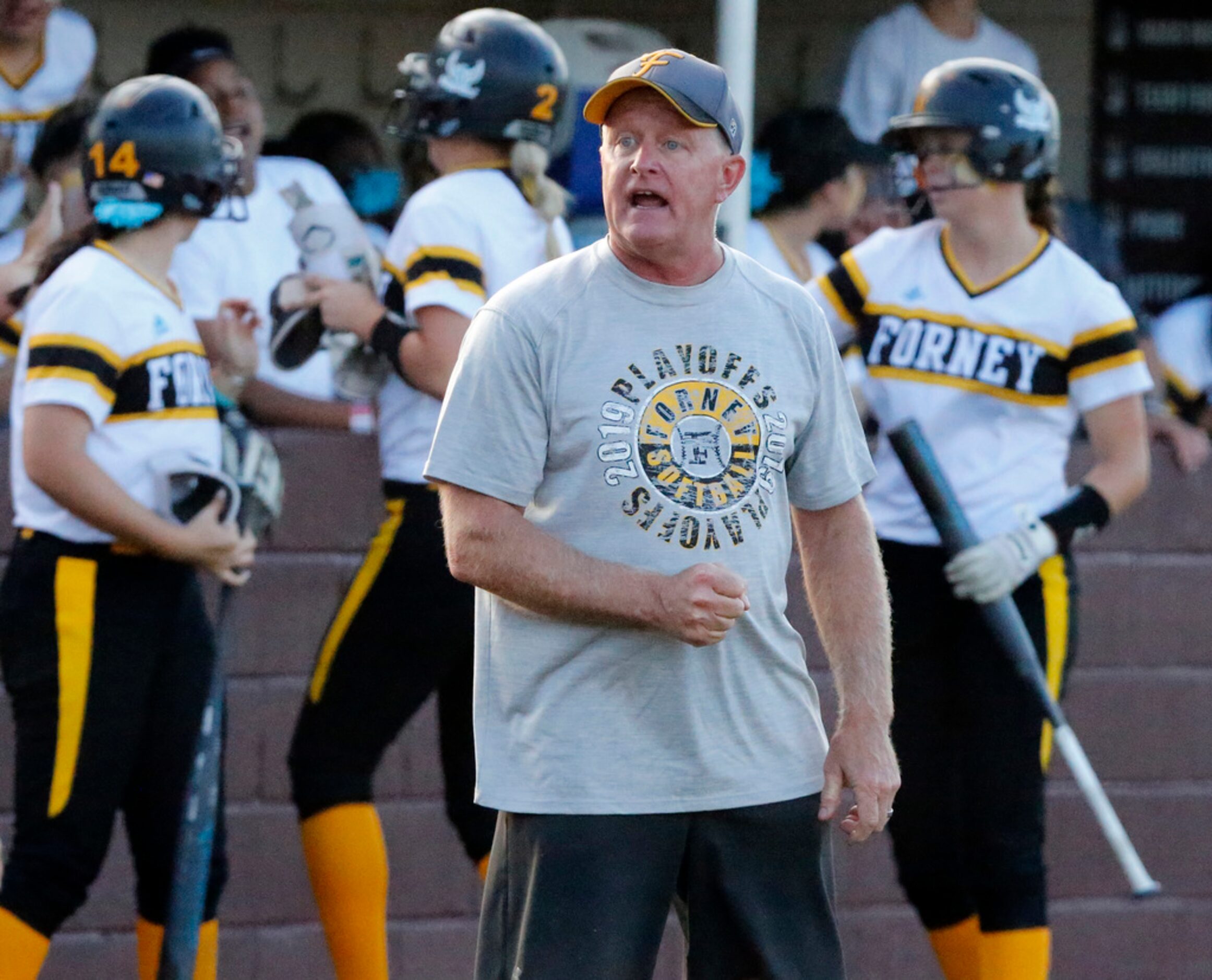 Forney High School head coach Pat Eitel gives instruction to his next batter in the second...