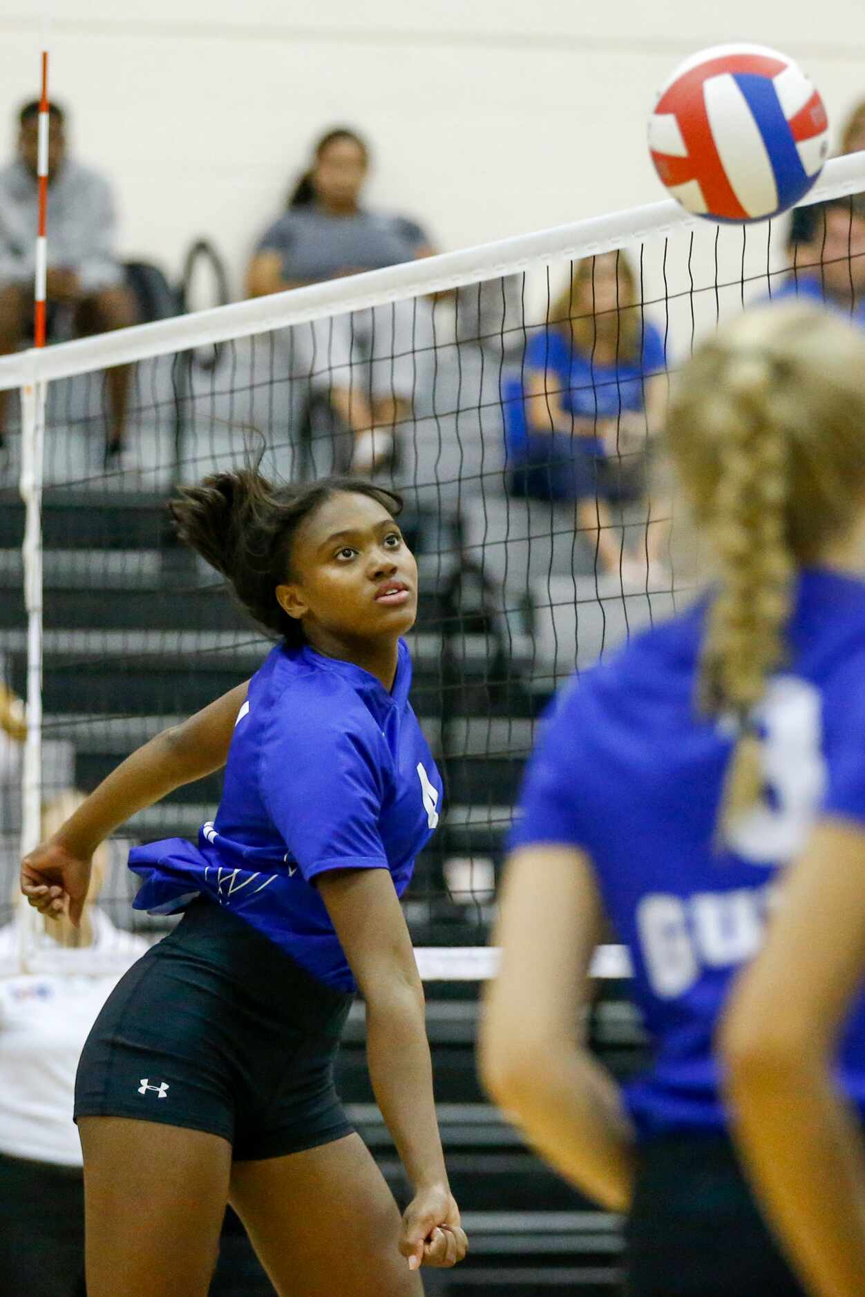 Denton Guyer middle blocker London Hunt (4) swings for a ball during the third set of a...