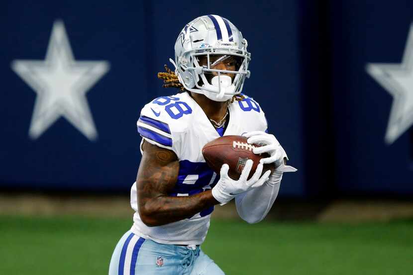 Dallas Cowboys wide receiver CeeDee Lamb (88) pulls in a fourth quarter touchdown pass in...