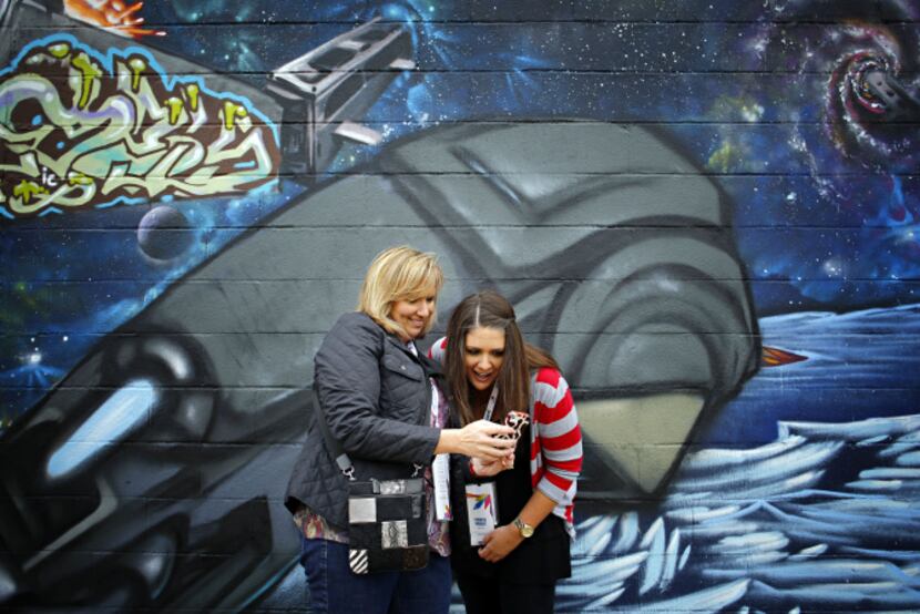 Stacy Hopkins (left) and Jennifer Wright admired their picture-taking skills after attending...