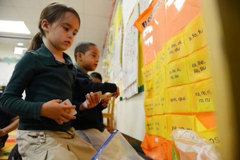 
Selah Triska (left) and Christian Chavez practice Spanish words in class at Sanger...