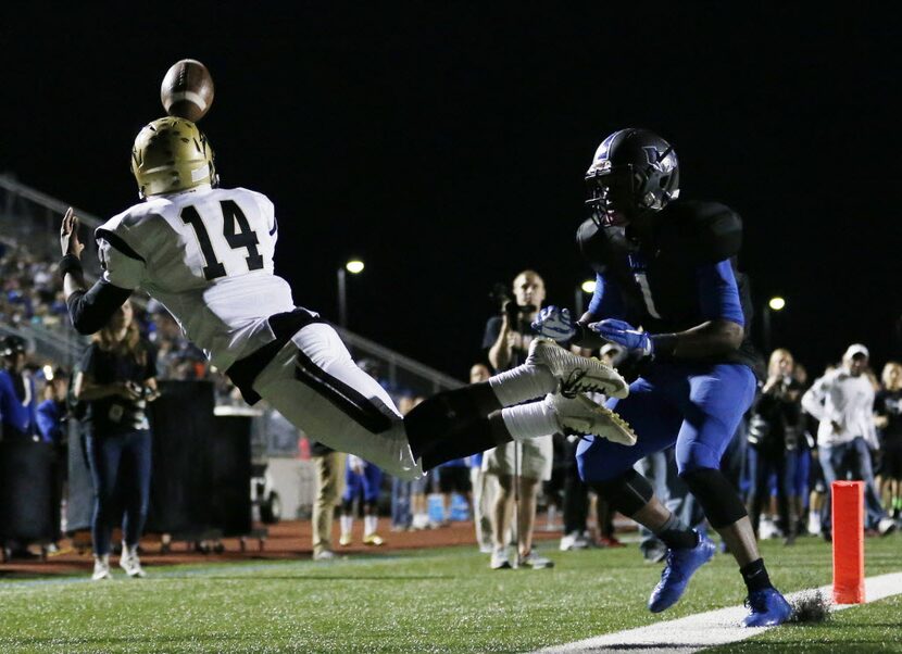 Plano East wide receiver Cameron Moore (14) is unable to make a catch during a double...