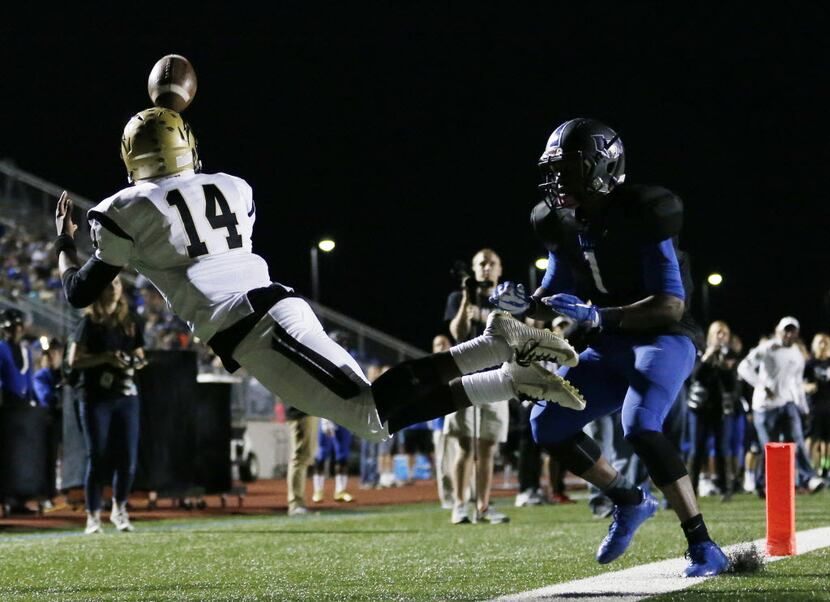 Plano East wide receiver Cameron Moore (14) is unable to make a catch during a double...