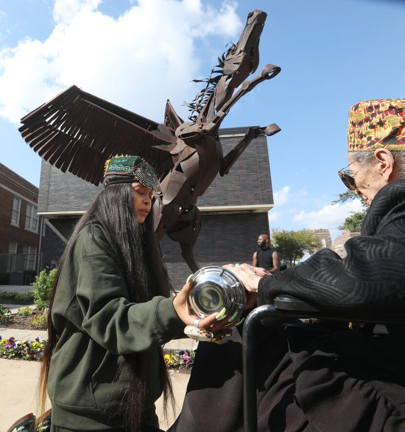 Erykah Badu, left, and Ruth Price Sanders dedicate the school's time capsule during the...