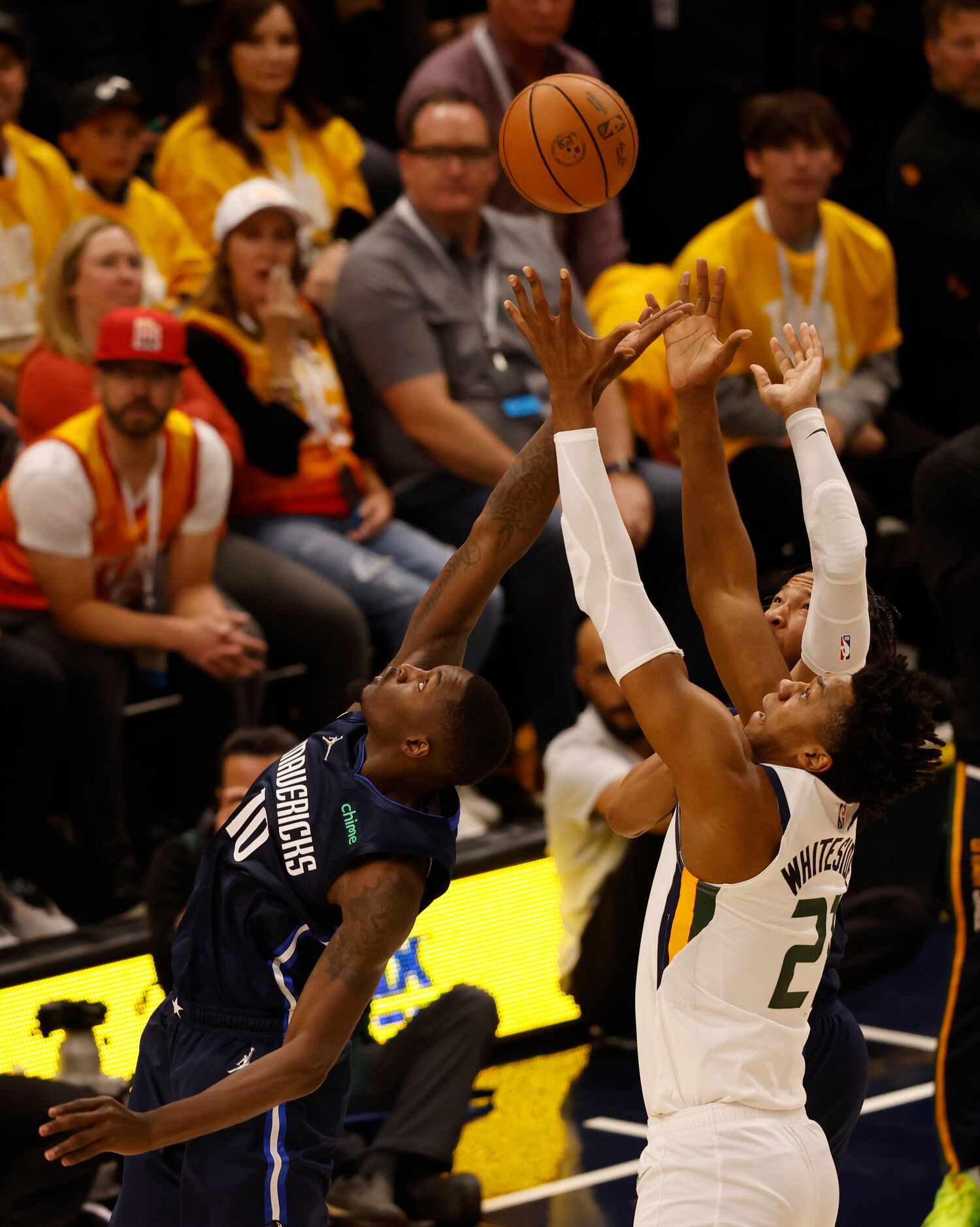 Dallas Mavericks forward Dorian Finney-Smith (10) and Utah Jazz center Hassan Whiteside (21)...