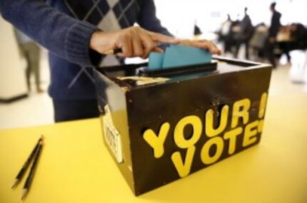  Eighth grade votes are stuffed into a box in the John B. Hood Middle School cafeteria...