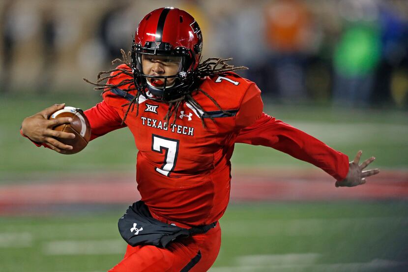 Texas Tech's Jett Duffey runs with the ball during the first half of an NCAA college...