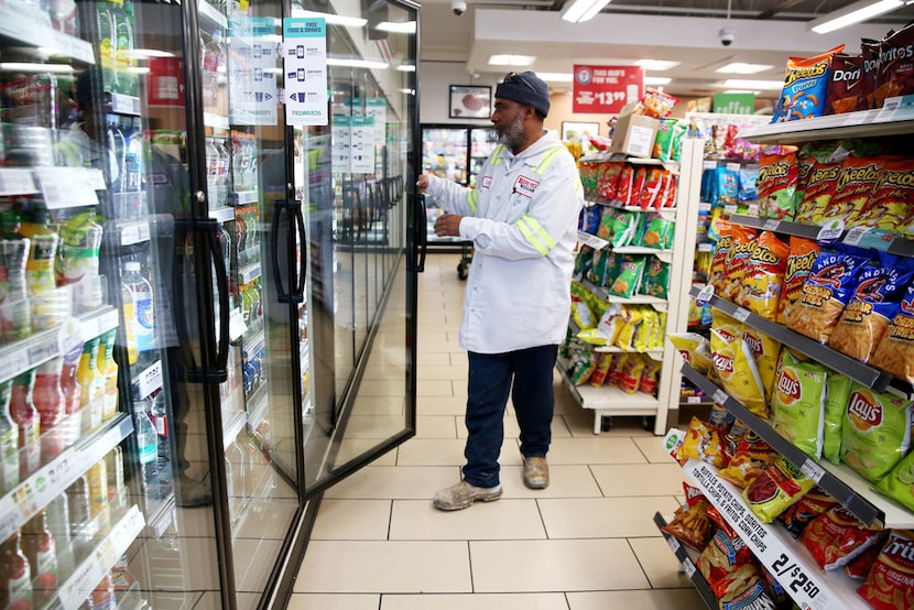 Cedrick Williams picks out a Gatorade at 7-Eleven in downtown Dallas.