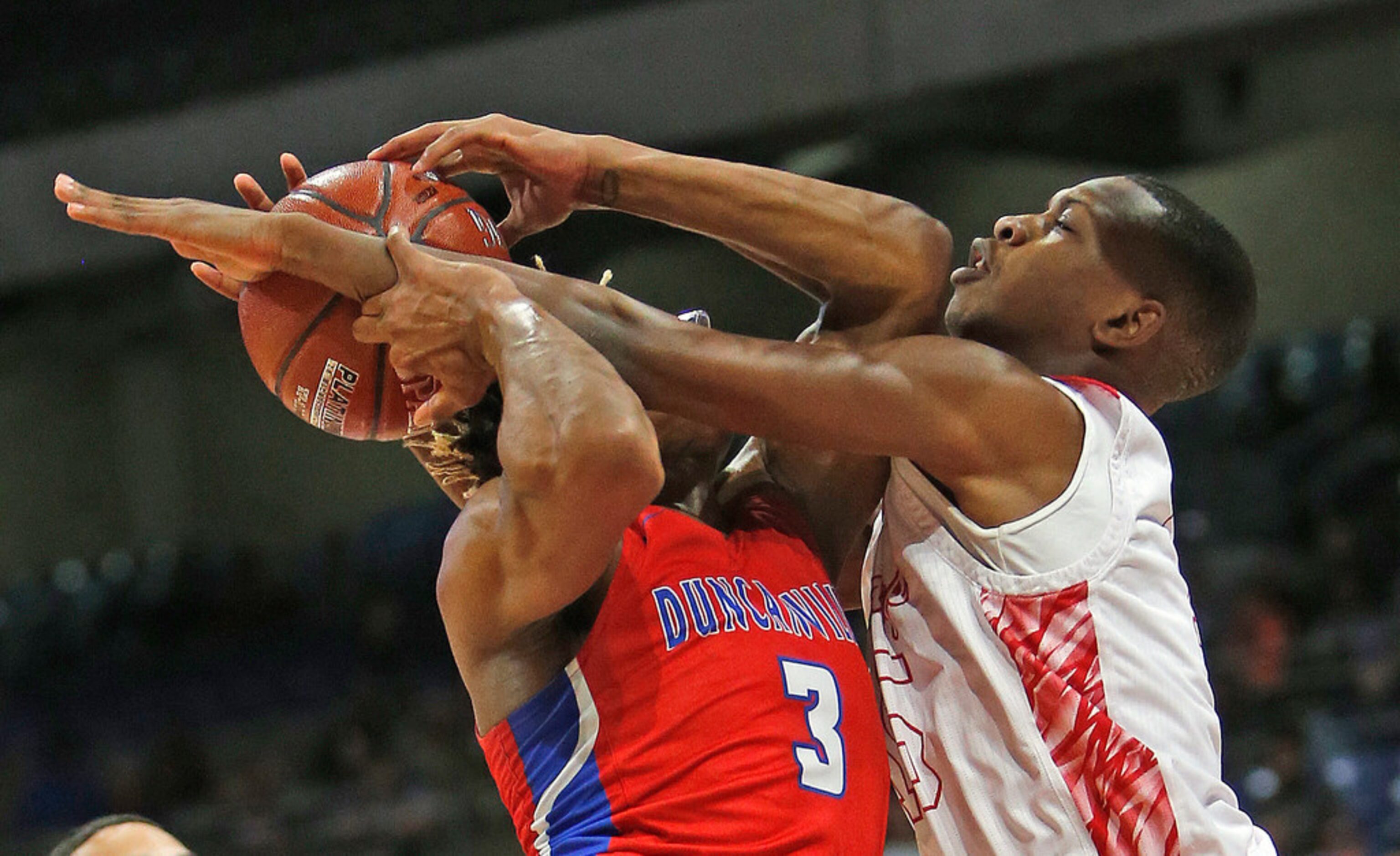 Duncanville's Jahmi'us Ramsey #3 is guarded tightly by Galena Park North's Jalen Means #15....