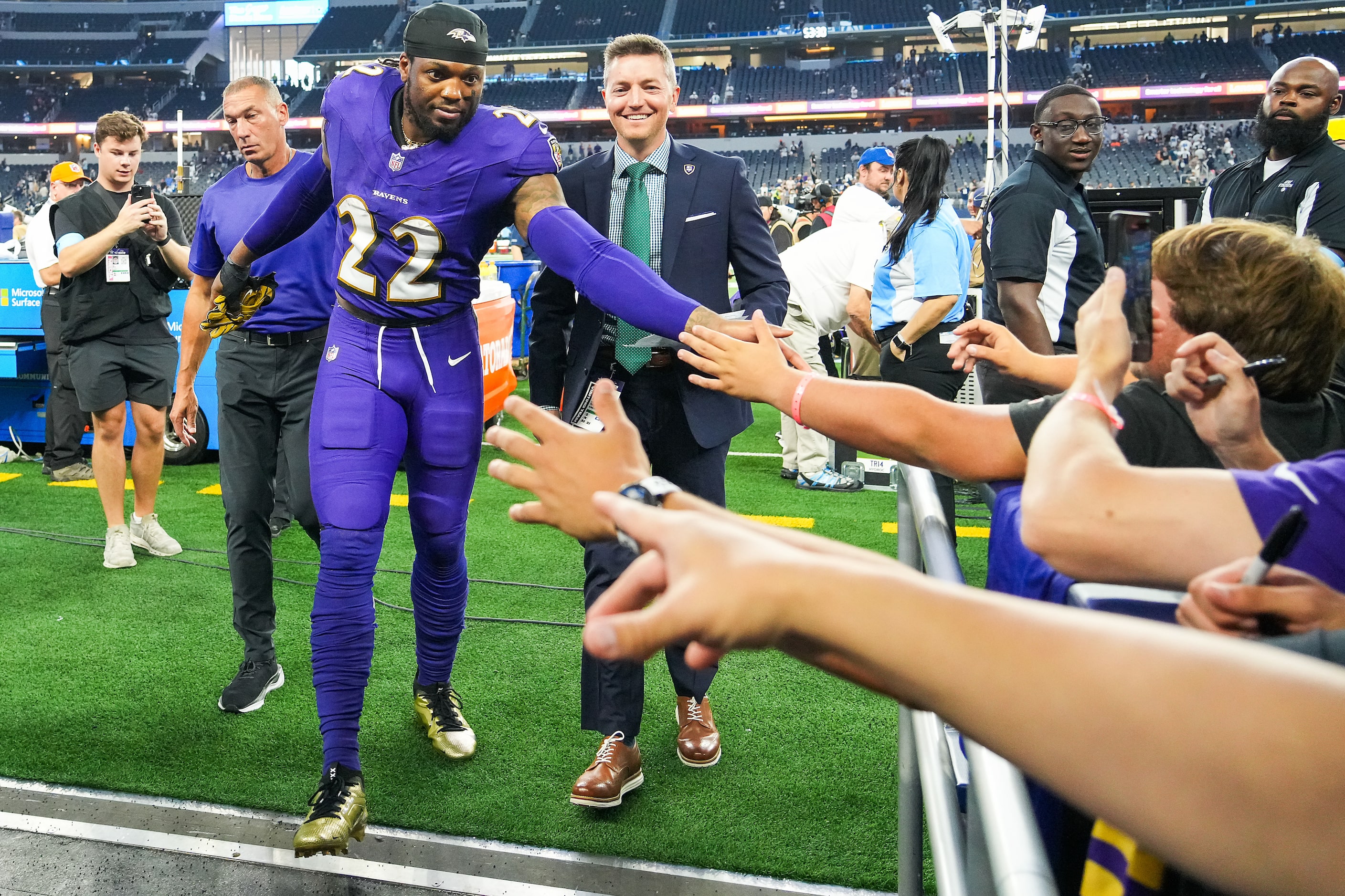 Baltimore Ravens running back Derrick Henry celebrates with fans after the Ravens 28-25...